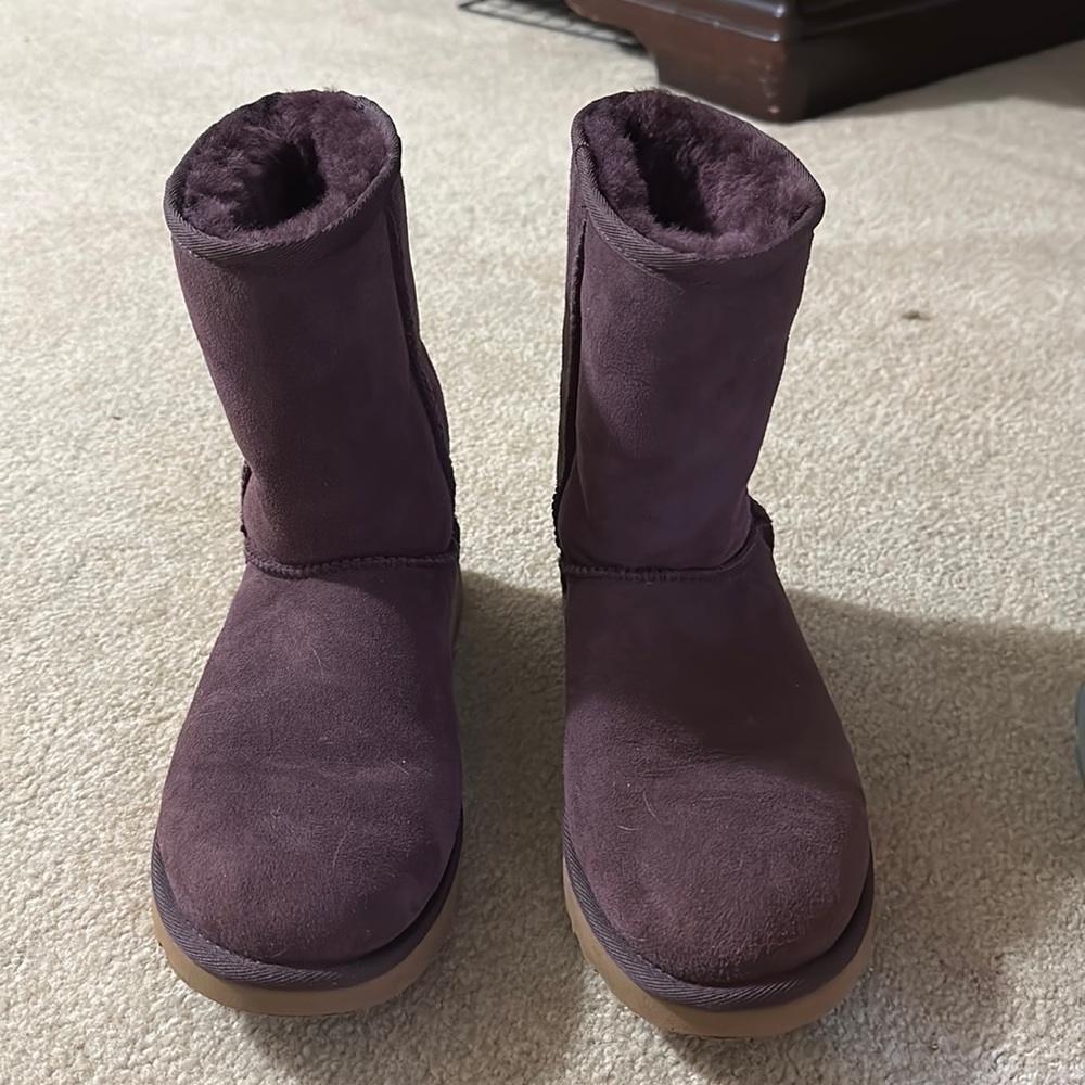 Woman’s purple Ugg boots